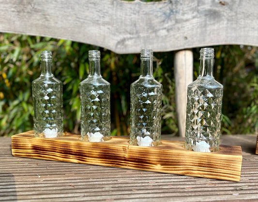 Tischleuchter vierflammig mit alten Three Sixty Vodka Flaschen - Glas auf Holz - besonderes Unikat auf Kantholz – Auftragsarbeit