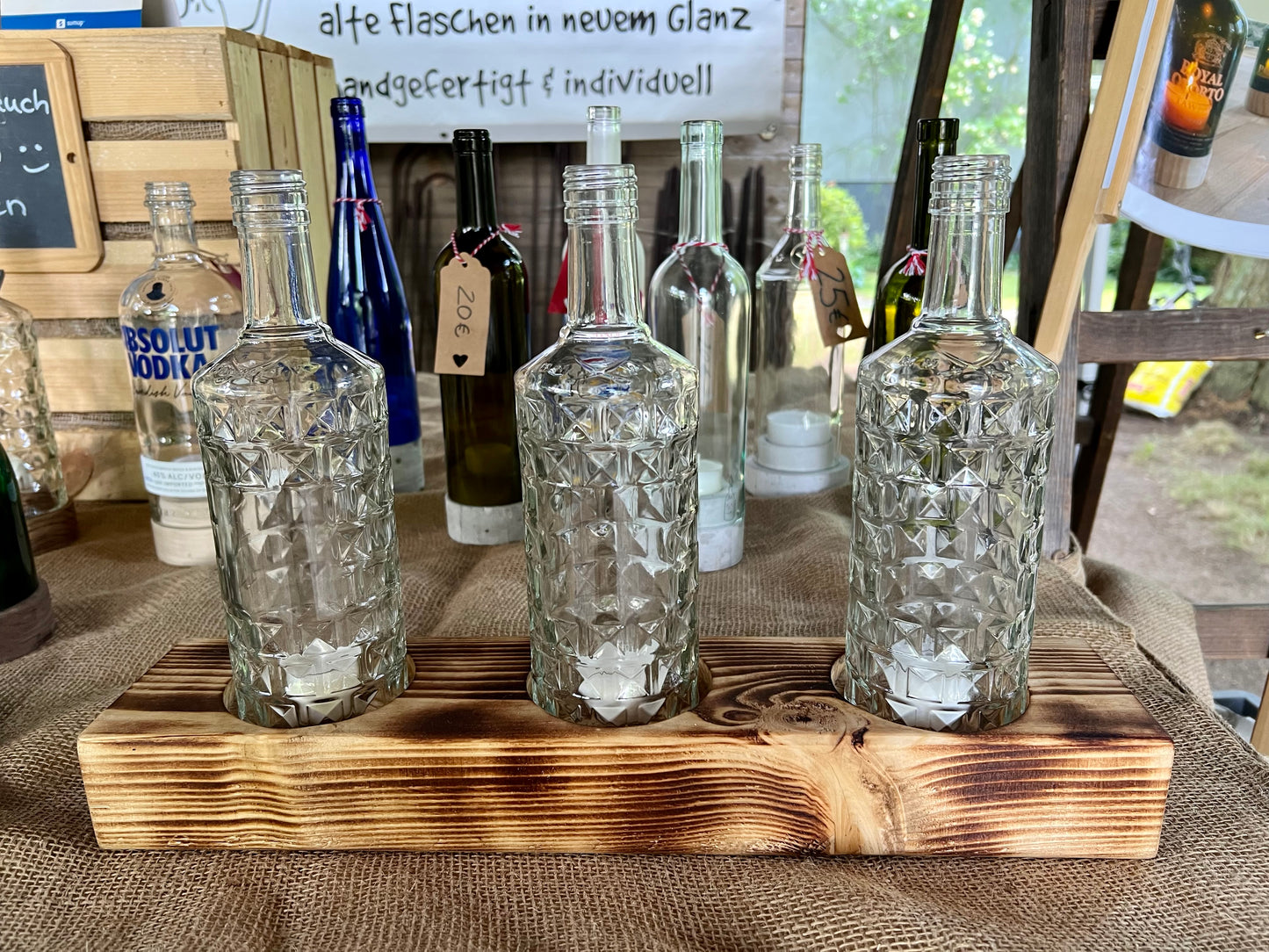 Tischleuchter dreiflammig mit alten Three Sixty Vodka Flaschen - Glas auf Holz - besonderes Unikat auf Kantholz - Auftragsarbeit